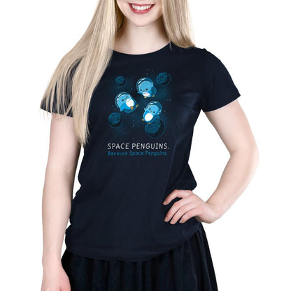 A woman in a navy blue T-shirt that says TeeTurtle Space Penguins.
