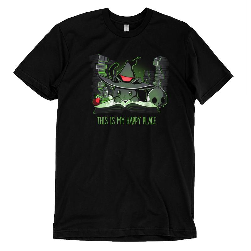 A black "Spellbound" T-shirt by monsterdigital featuring a graphic of a witch hat, magic potions, books, and a skull, with the text "This is my happy place" in green. Crafted from super soft ringspun cotton for ultimate comfort.