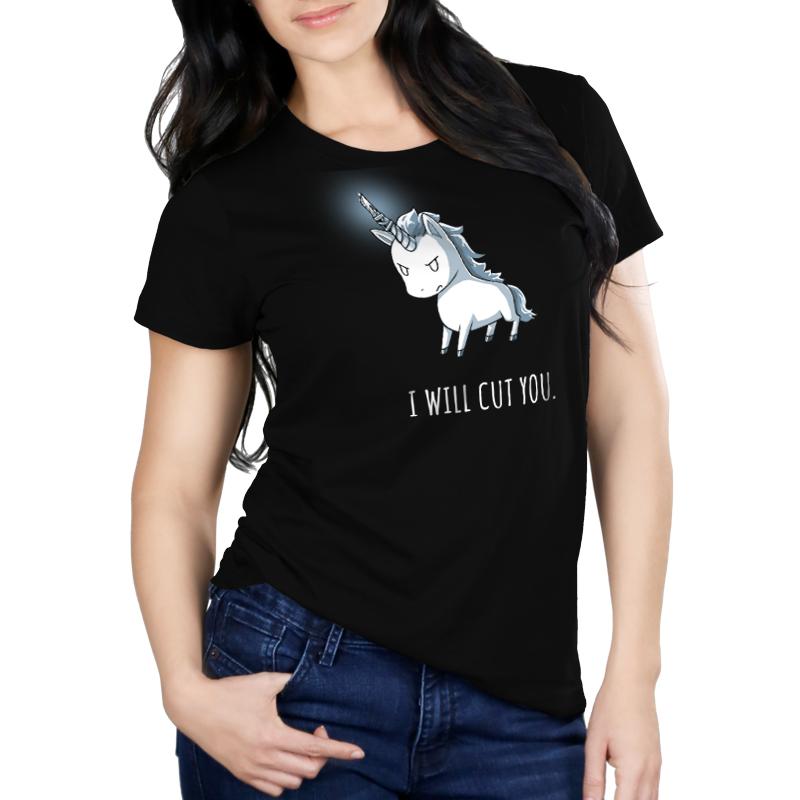 A woman wearing a black t-shirt with the TeeTurtle product "Stabby the Unicorn" original design.