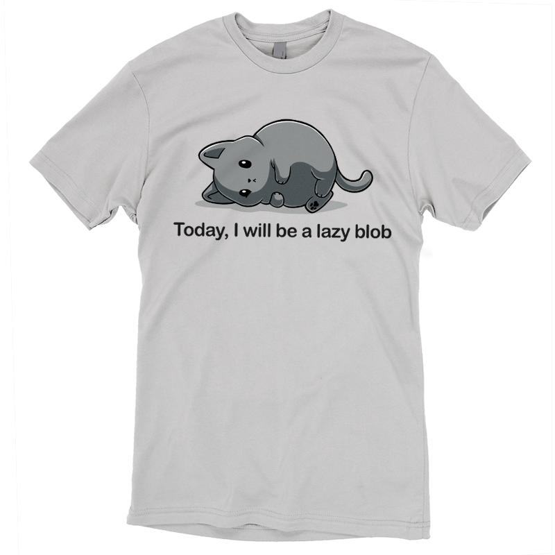 A silver t-shirt by monsterdigital featuring an illustration of a lazy cartoon cat lying down with the text "Today I Will Be A Lazy Blob" printed below it.