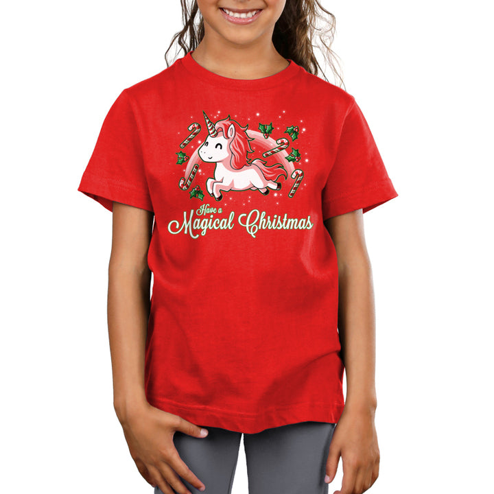 A girl wearing a TeeTurtle t-shirt that says Have a Magical Christmas.