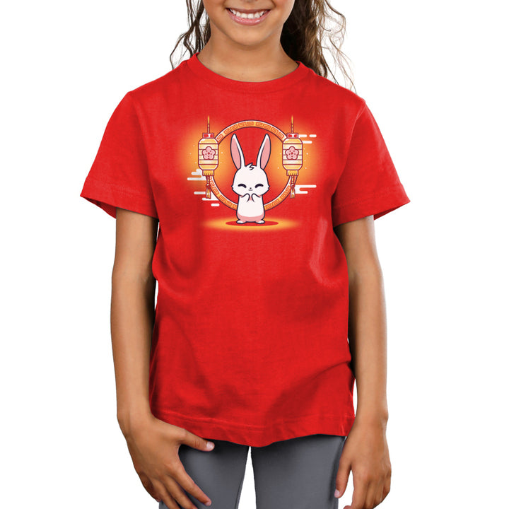 A girl wearing a red t-shirt with the Teeturtle Lunar New Year Rabbit celebrates Lunar New Year, the Year of the Rabbit.